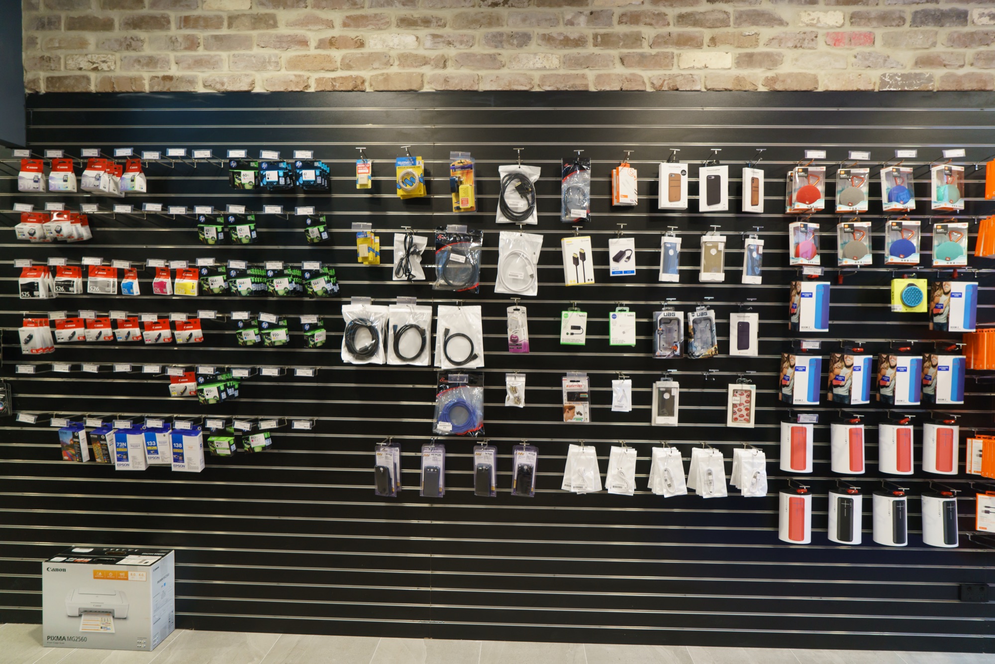 Wall of phone cables, chargers and accessories in store